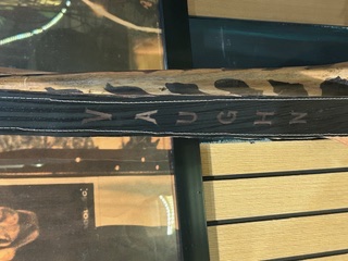 A name engraved into a handmade leather guitar strap